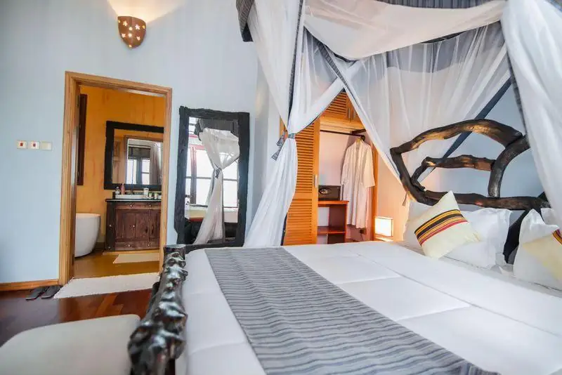 Comfortable Uganda lodge bed with mosquito net