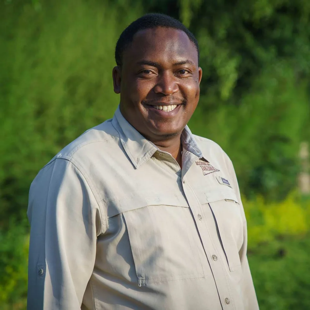 Portrait of Mr. Mugumya John, Lead Guide and Field Operations at Wild Spine Uganda
